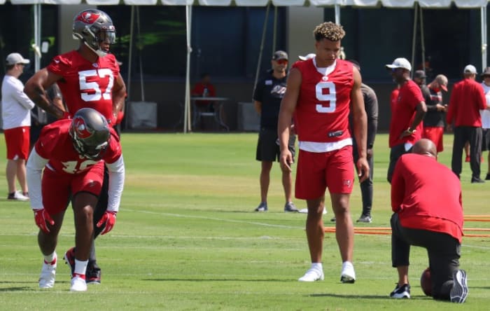 Buccaneers outside linebackers coach Larry Foote; outside linebackers Joe Tryon (No. 9), Quinton Bell (No. 57), and Cam Gill (No. 49)